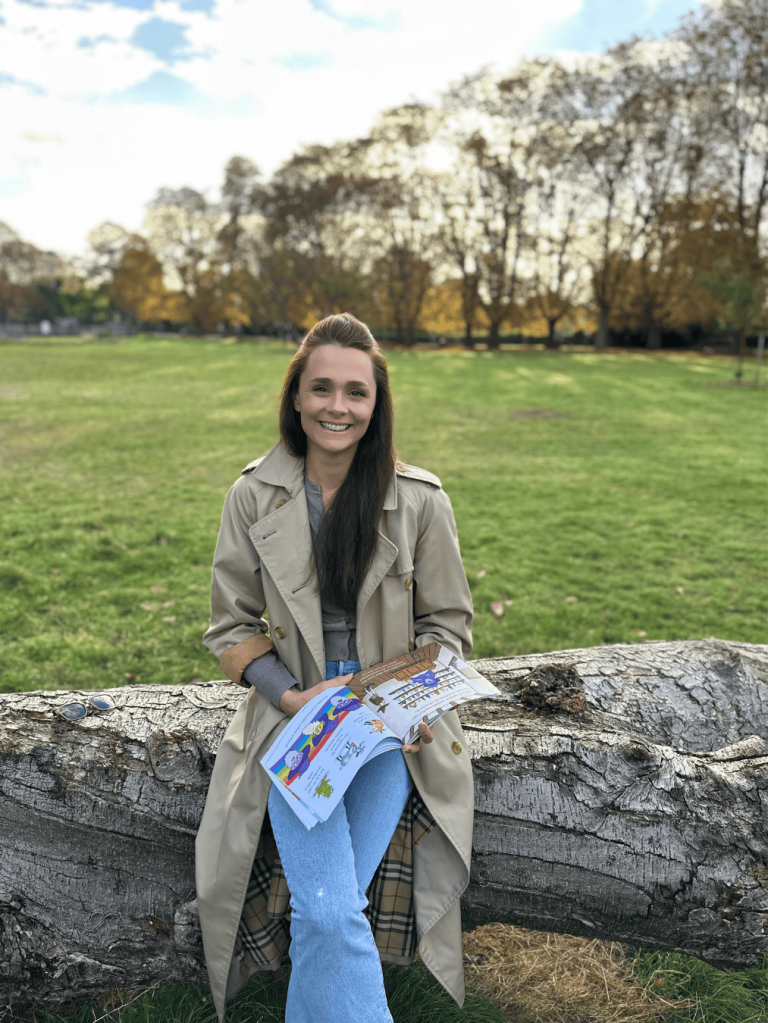 Autho-illustrator Mel Scott-Avis in park with book